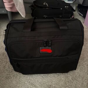 Tumi carry-on bag.